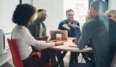 Multi-ethnic group of business persons having a meeting in the office