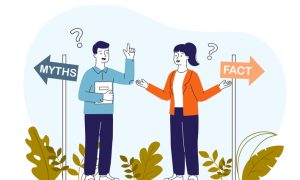 Illustration of two people standing between directional signs labeled “MYTHS” (left) and “FACT” (right). One person wears a blue shirt and dark pants, holding a book and raising a hand; the other wears an orange jacket over a white top with dark pants, gesturing with open hands. Question marks appear above their heads, with green plants at the bottom.