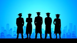 Graduates in the city silhouette.